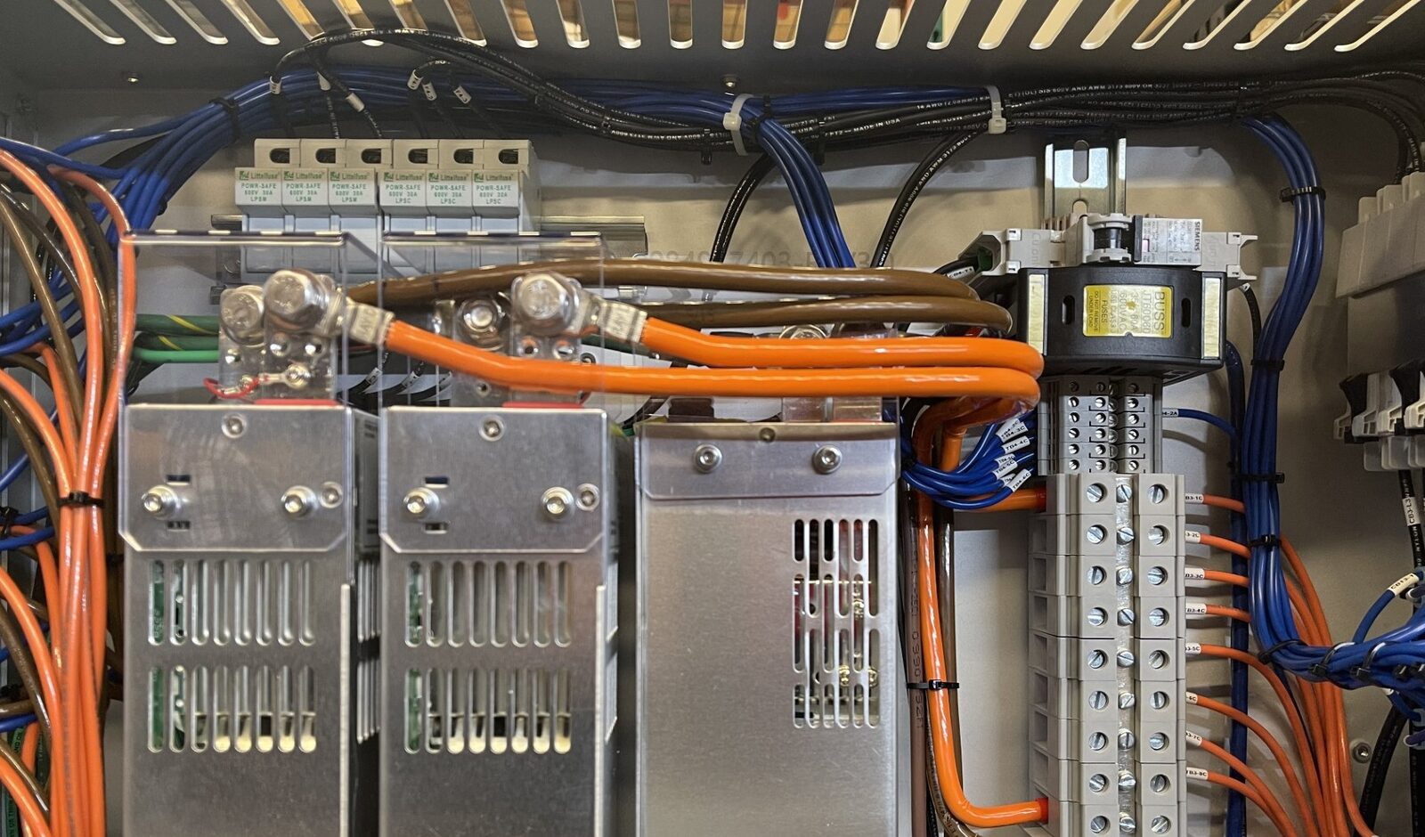 Close up of power supply modules and terminal blocks inside an HPN Electronics enclosure