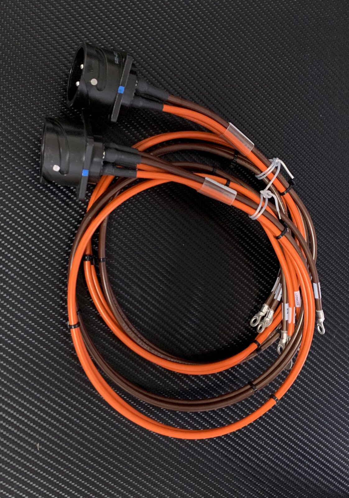 Coiled cable harness with dual high voltage connectors